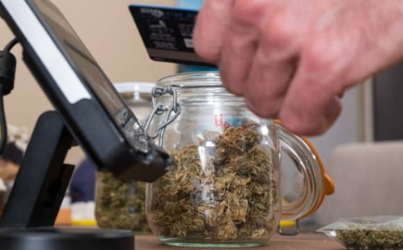 istockphoto-1177767360-612×612 Purchasing legal marijuana at a local dispensary using my card as a method of contactless payment.